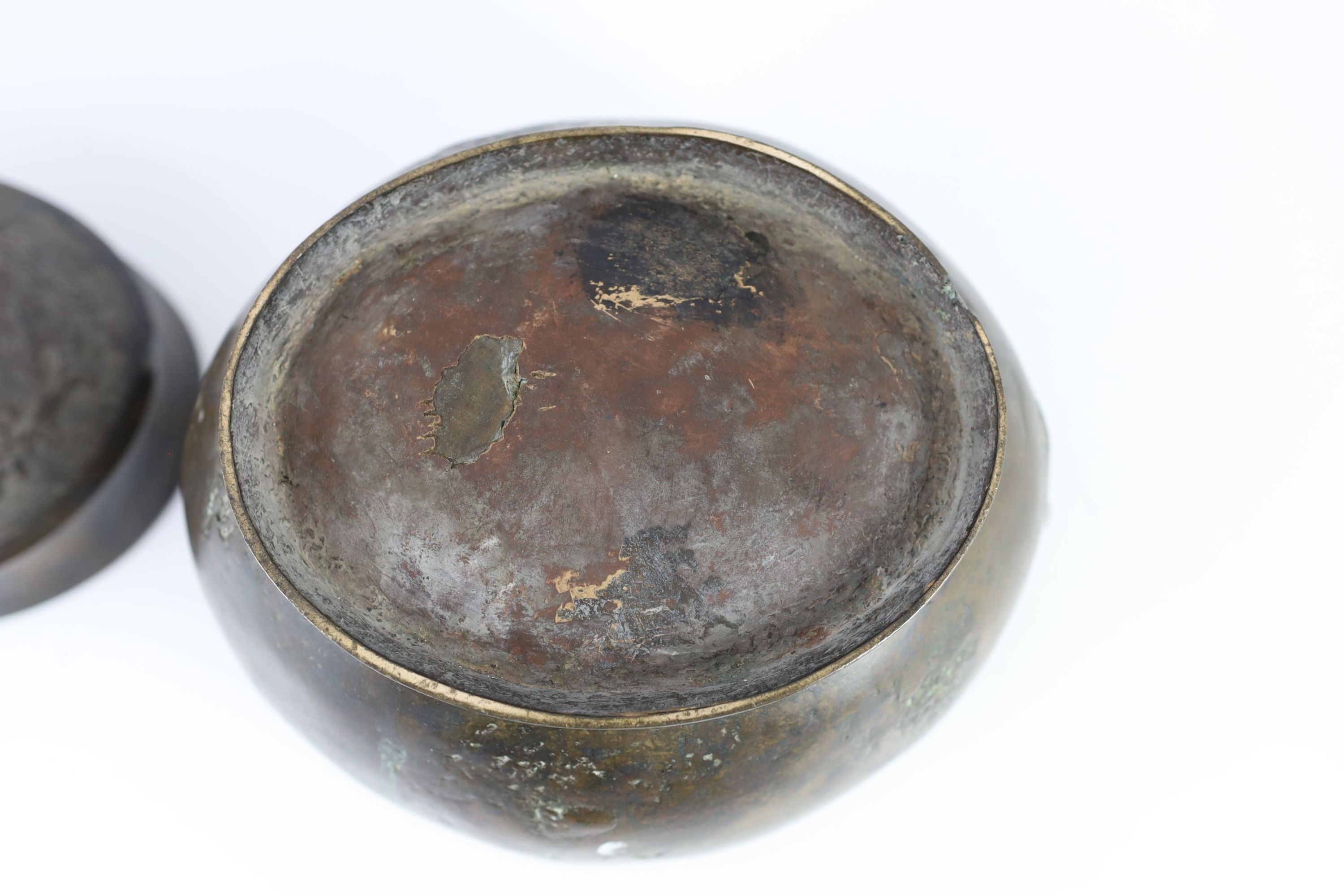 A Chinese Ming bronze jar and cover, hu, 26cm high, old repairs